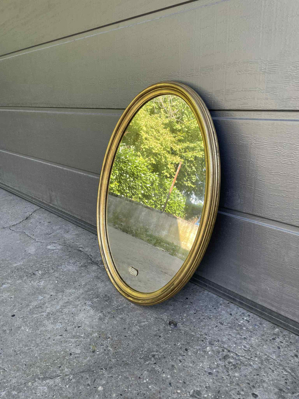 Miroir ovale doré