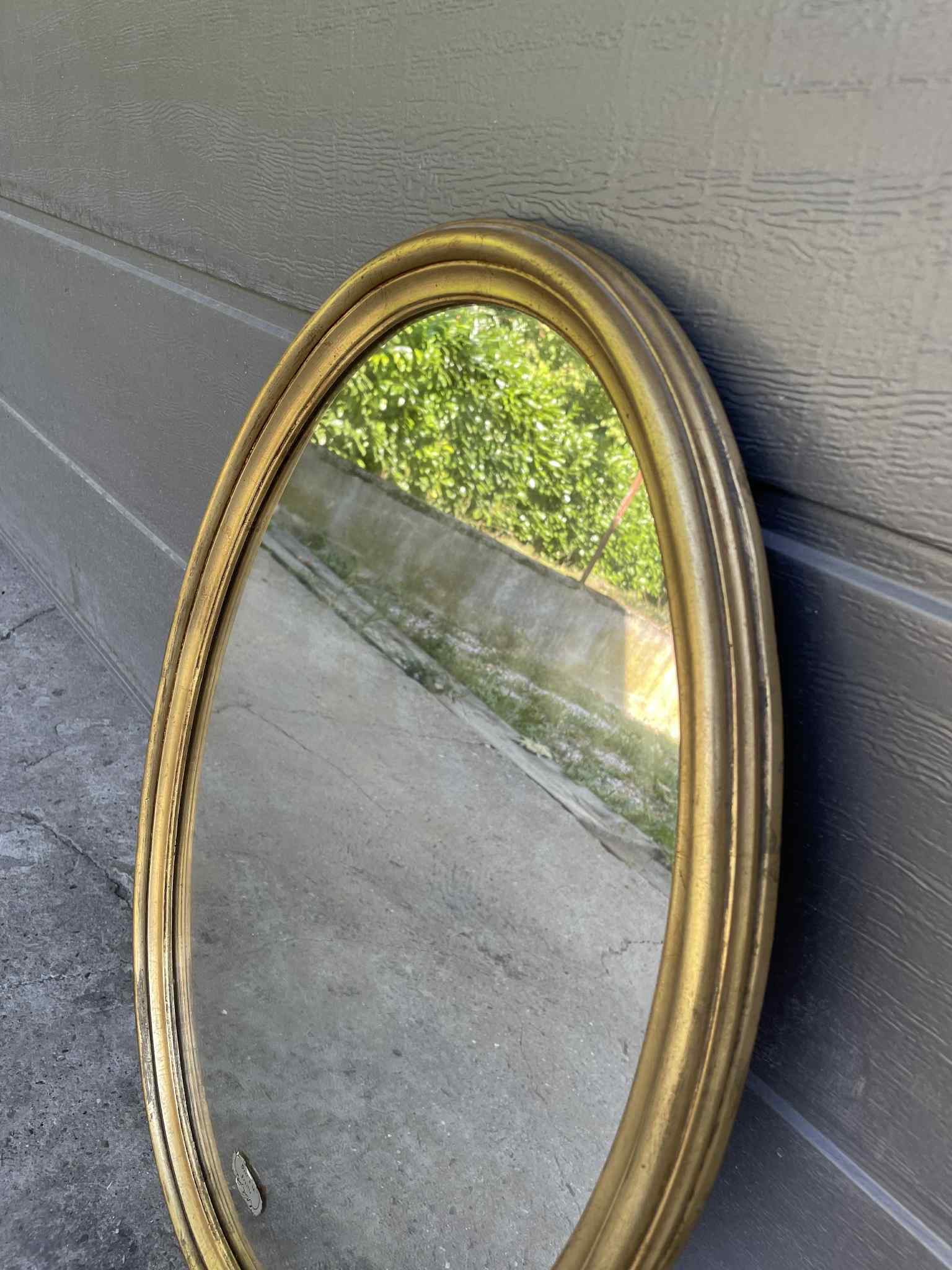 Miroir ovale doré